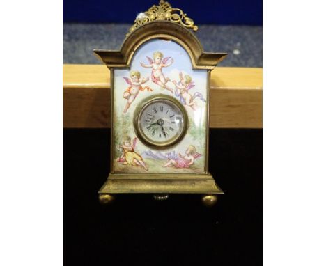A CONTINENTAL MINIATURE ENAMEL CLOCK