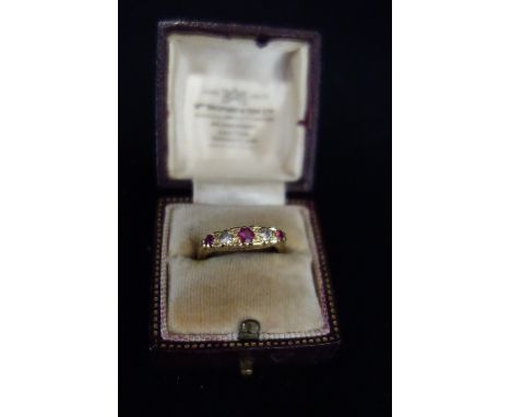 A 'RUBY' AND DIAMOND RING, on an 18ct yellow gold shank, ring size K