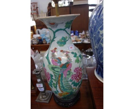 A CHINESE VASE OF BALUSTER FORM decorated in enamels with birds and flowers and calligraphy (drilled and mounted as a lamp), 