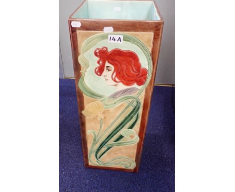 AN ART NOUVEAU MAJOLICA STICK STAND decorated with naturalistic forms and a woman's head