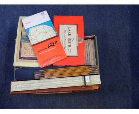 A COLLECTION OF ORDNANCE SURVEY MAPS and a collection of slide rules