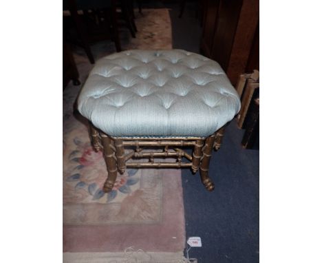 A REGENCY GILTWOOD BAMBOO STOOL with a blue buttoned top and a modern black framed mirror