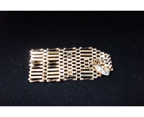 A 9CT YELLOW GOLD GATE-LINK BRACELET, with padlock clasp, approx. 17grams