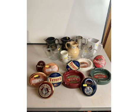 Collection of breweriana including ashtrays, whisky jugs, glass tankards, ceramic beer pump signs etc.