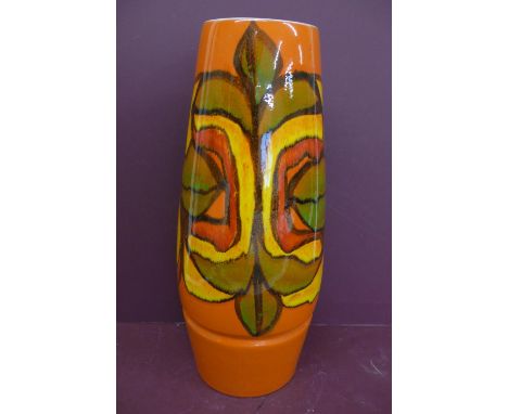 Large Poole cylindrical pottery vase, orange, yellow, red, green and black abstract design on an orange ground - height 16.5i