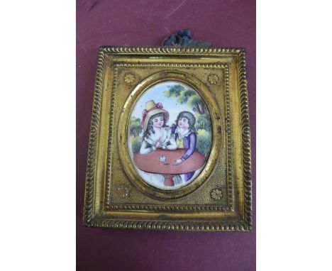 18thC Continental oval enamel miniature of a boy and girl playing with a spining top in original brass frame - ht. 4.25 ins 