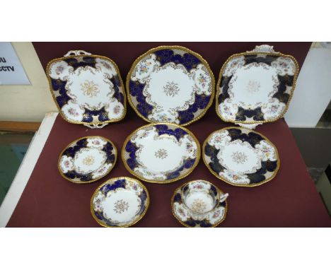 A Coalport dinner service for twelve persons - panel cobalt pattern consisting of 12 dinner plates 10.75 ins, 8 dessert plate