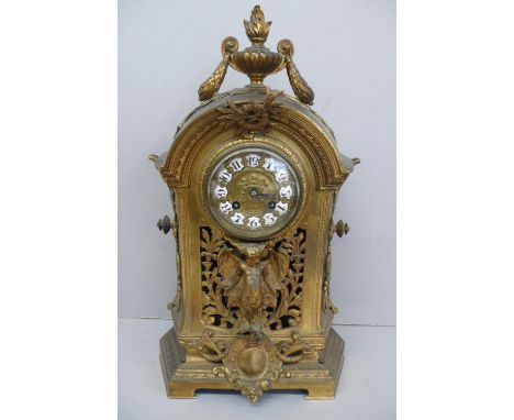 19thC French ormolu mantel clock with flaming urn finial to dome top, enamel numerals to brass dial, two keyholes, angel to p