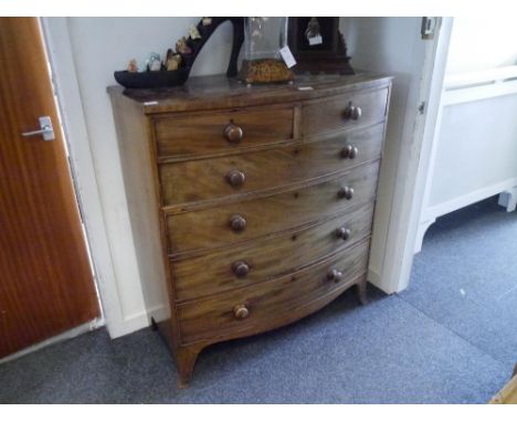 A Victorian mahogany bow fronted chest of drawers with two short over four long drawers, on bracket feet