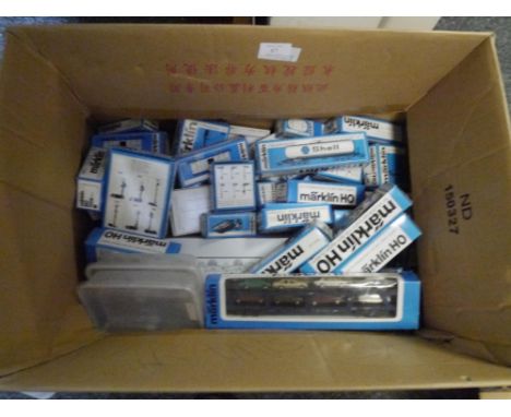 A box containing approximately forty boxed Marklin HO gauge  rolling stock including car transporter, goods wagons, Esso tank