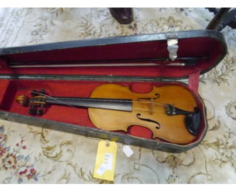 A full size violin, probably German, of Maggini type, with two piece back and cased with bow 38cm