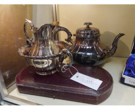A group of Elkingtons silver plate comprising a three piece tea service and a cased pair of servers