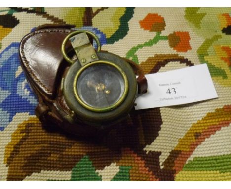 A World War I brass prismatic compass Verners Pattern VIII with arrow mark and dated 1917 in a fitted leather case stamped St