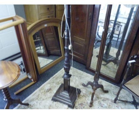An Edwardian mahogany standard lamp with turned column on square base