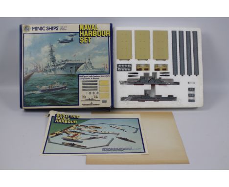 Triang - Minic - A boxed Naval Harbour Set in 1:1200 scale. The items inside appear Mint and the set is complete, the box is 