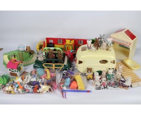 Sylvanian Families - A large quantity of Sylvanian Families items including car, caravan, canal boat, Betty's Box shop and se