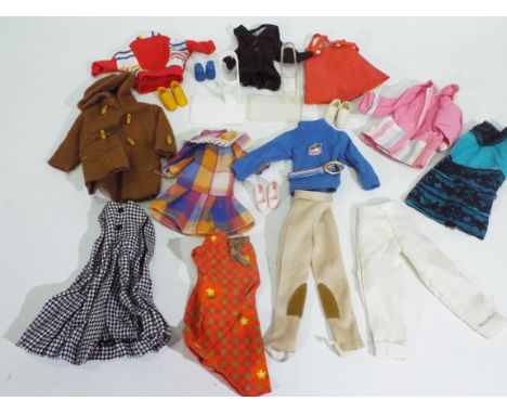 Sindy - A collection of 12 x items of vintage Sindy clothing and 4 pairs of shoes including a two coats, a horse riding outfi