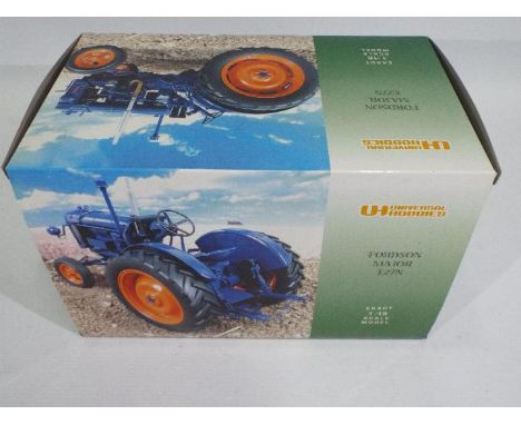 Universal Hobbies - A boxed Fordson Major E27N tractor in 1:16 scale # 90928. The model appears Near Mint but the left headla