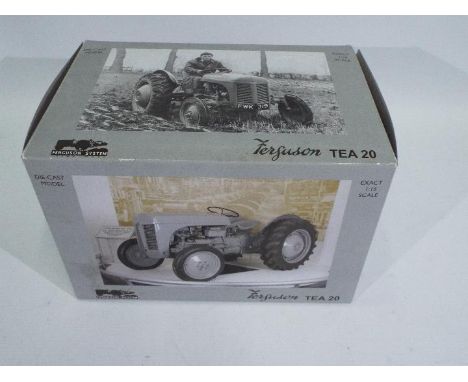 Universal Hobbies - A boxed Ferguson TE20 tractor in 1:16 scale # 99702. This model appears Mint in a Good box with a little 