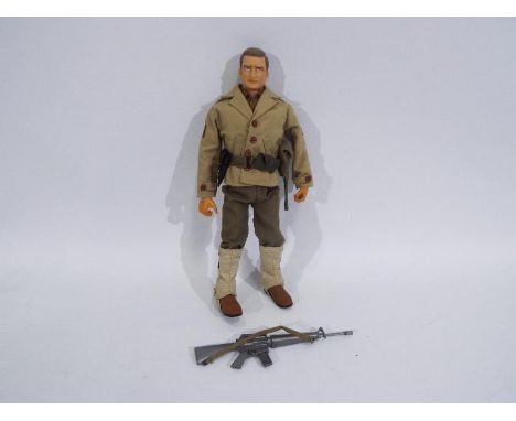 Tsukada, Takara, Palitoy - An unboxed 1/6 scale 'Combat Joe' action figure of a WW2 US Soldier. The brown hard painted head f