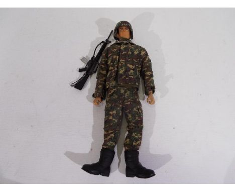 Takara - An unboxed 1/6 scale 'Combat Joe' action figure of a Modern US Soldier in camouflage fatigues. The dark brown hard p