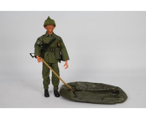 Pedigree, Tommy Gunn - An unboxed Pedigree 'Tommy Gunn' Commando action figure. The brown painted head figure, with blackened
