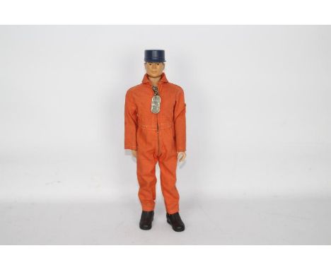 GI Joe, Hasbro - An unboxed vintage GI Joe 'Talking' Pilot action figure. The brown painted hard head figure is marked 'G.I. 