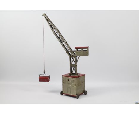 Joustra - A vintage clockwork tinplate mobile crane. The model stands 62 cm tall and the clockwork motor does work but there 