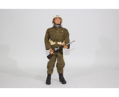 Palitoy, Action Man - An unboxed Palitoy Action Man in Air Police outfit. The brown painted hard head Action Man is marked  '
