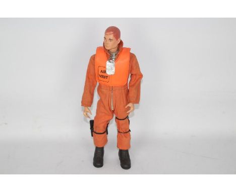 Palitoy, Action Man - An unboxed vintage Palitoy Action Man in Pilot attire. The red painted hard head figure is marked 'Made