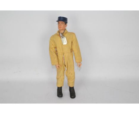 GI Joe, Hasbro - An unboxed vintage GI Joe Pilot action figure. The brown painted hard head figure is marked 'G.I. JOE REG.T.