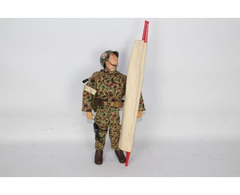 GI Joe, Hasbro, Action Man - An unboxed vintage Hasbro GI Joe action figure in Marine Medic outfit. The black painted hard he