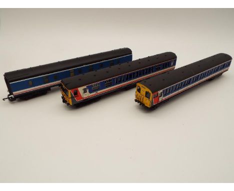 An OO gauge model Southern Pride two car unit op nos 75055 and 76992, and a Lima corridor carriage, as illustrated, appears e