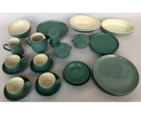 A Denby pottery part green and cream dinner service including plates, dishes, jugs, cups, saucers and various other items
