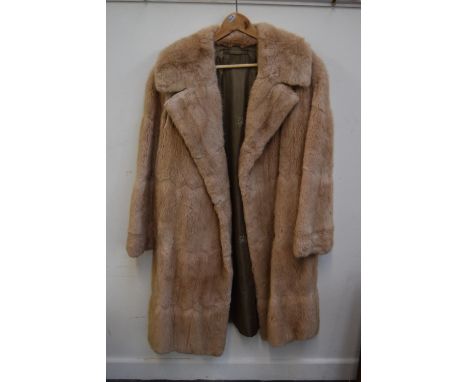 A natural fur light brown over coat (small tear above right arm)