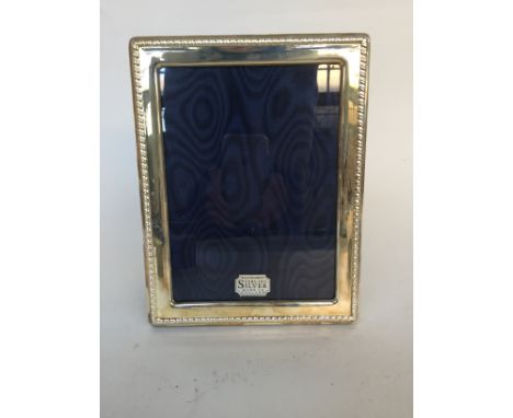 A Sterling Silver picture frame with gadroon borders by R.Carr Ltd Sheffield 1990 17 x 22cm frame size 13x18cm picture size