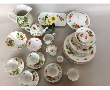 A Queens Rosina China 'Virginia Strawberry' pattern dinner service (part) including dinner plates, bowls, side plates, teapot