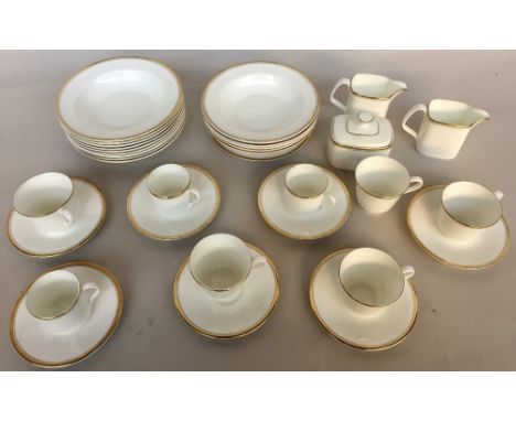 A Royal Doulton 'Gold Concord' pattern part tea and coffee service to include five tea cups, three coffee cups, seven saucers