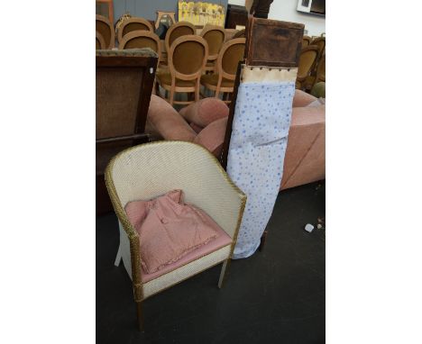 A vintage folding wooden ironing board together with a Lloyd Loom bedroom chair with cushion