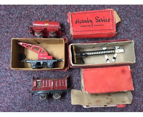 Four 0 Gauge Hornby trains in original boxes to include a No2 Double Arm Signal, a Shell Petrol Tank Wagon, a Guard's Van and