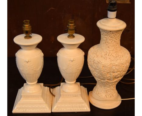 A pair of Hawksworth creamware ceramic based table lamps and one other