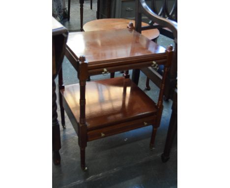 A square side table with turned fluted supports, a pull our shelf over narrow inlaid drawer raised on castors 45 x 37 x 62cm