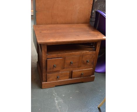 A teak side cabinet with galleried shelf