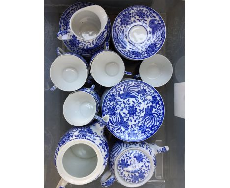 A Noritake Howo blue and white part tea set including eleven side plates, seventeen saucers, ten tea cups, two tea pots (one 