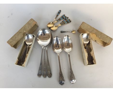 A Selection of EPNS flatware some cased to include two Lilly pattern spoon, three large service spoon with a beaded and flowe