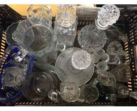 A selection of glassware including a ships decanter and two other decanters all with stoppers, jugs and of various sizes and 
