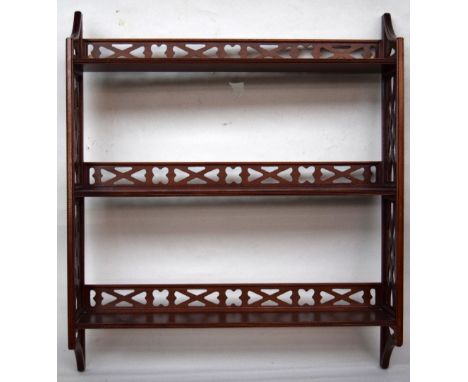 A George III style hanging shelf with three tiers pierced supports and galleried top 62 x 73cm together with a Victorian waln