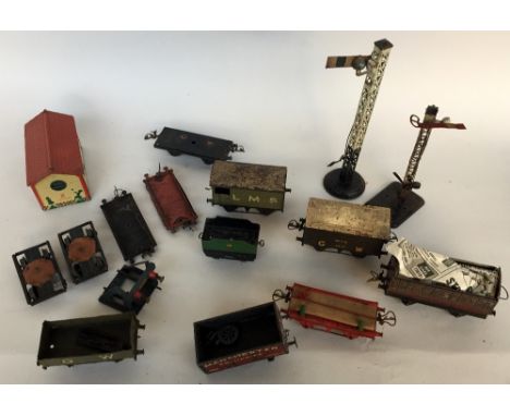 A selection of tin Hornby 0 Gauge wagon and accessories to included one LMS coach in maroon livery, a Milk Traffic Van GW bro