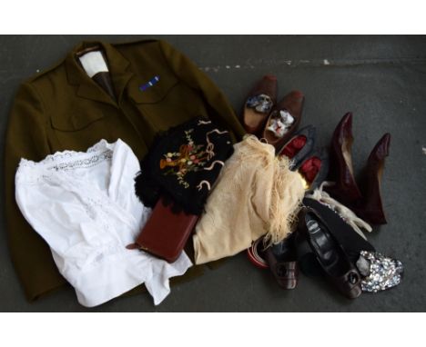 A British Army dress jacket in green with medal ribbon, a small white broderie anglaise cardigan, a vintage embroidered dress