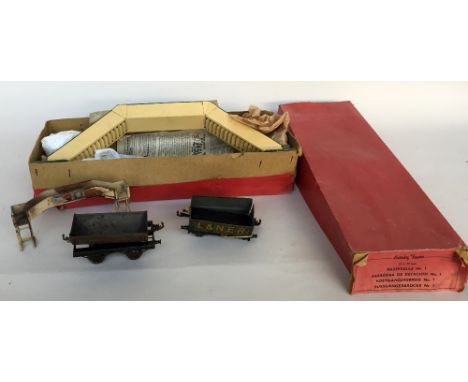 A vintage boxed tin Hornby Trains Gauge 0, footbridge No1 with an open six planks wagon L&NER 1924, a Sir Robert McAlpine & S